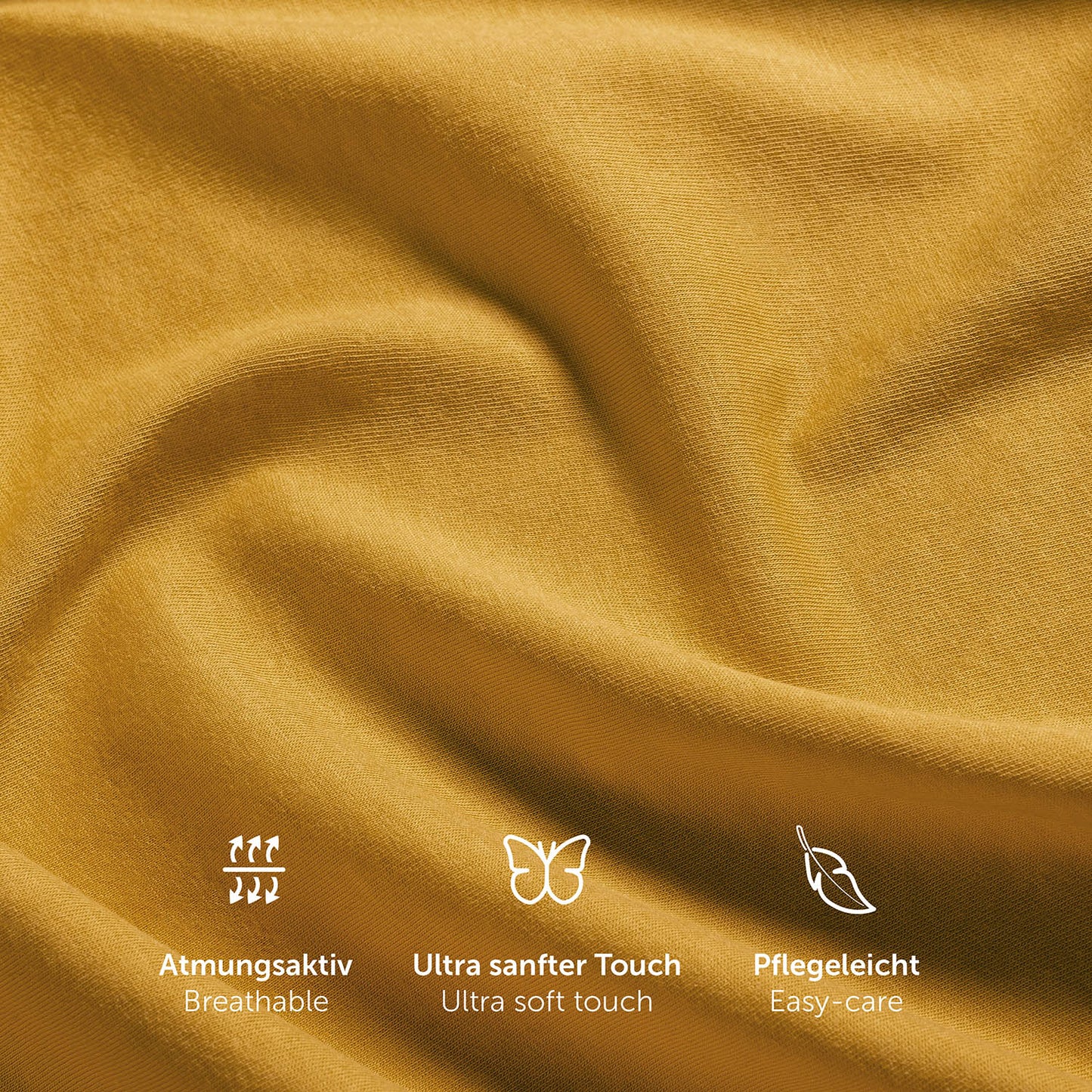 Nahaufnahme der Textur eines gelben Spannbettlakens mit Symbolen für Atmungsaktivität ultra weichen Touch und Pflegeleichtigkeit.