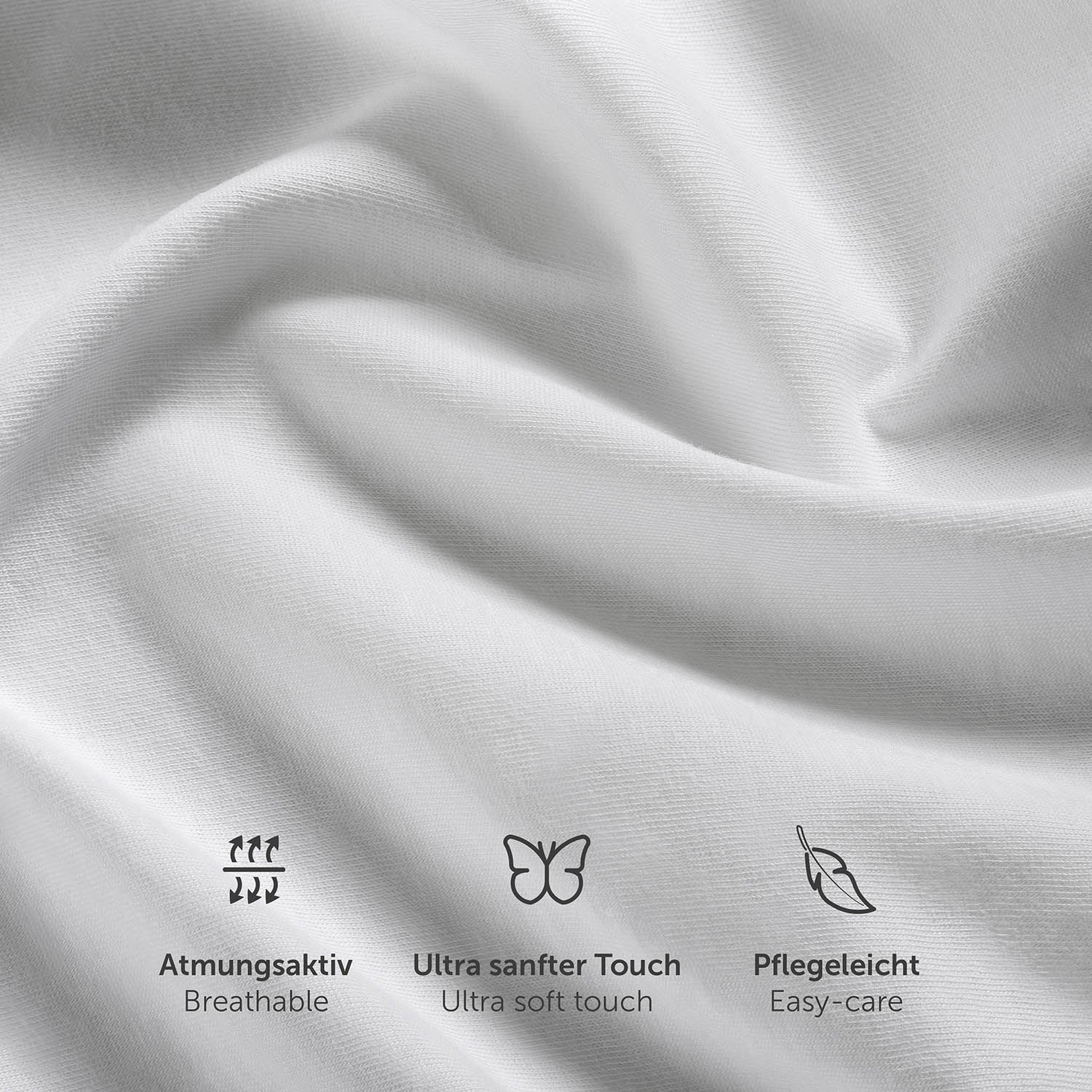 Nahaufnahme der Textur eines weißen Spannbettlakens mit Symbolen für Atmungsaktivität ultra weichen Touch und Pflegeleichtigkeit.