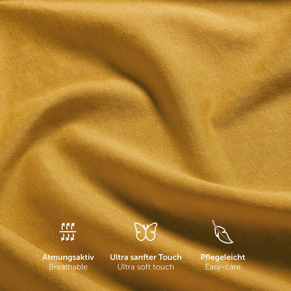Einzelnes gelb Spannbetttuch aus 100% natürlicher Baumwolle auf Matratze.